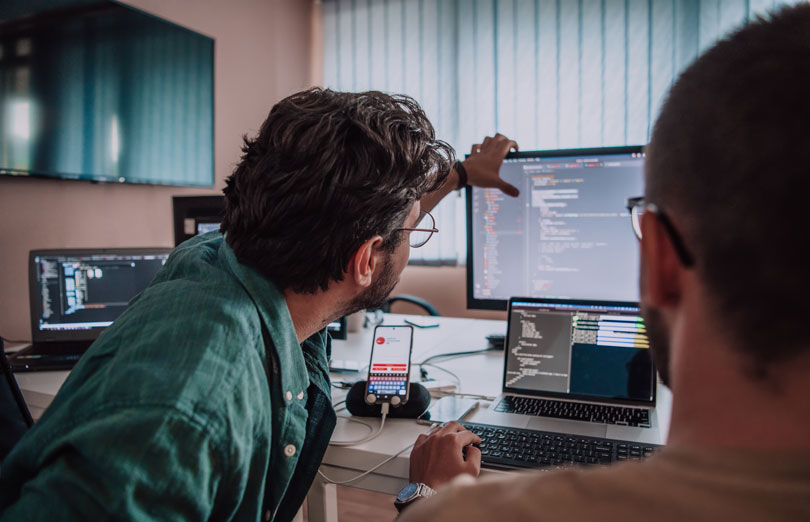 A gavel in front of a monitor, showing a data network